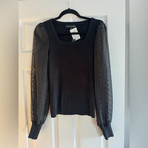 Black sweater, polkadot sleeve